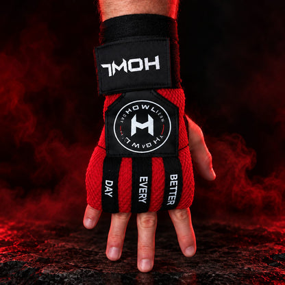 Red HOWL Quick Wraps worn on hand showing HOWL branding