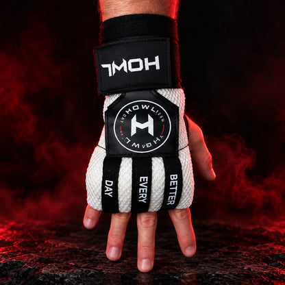 White HOWL Quick Wraps worn on hand showing HOWL branding